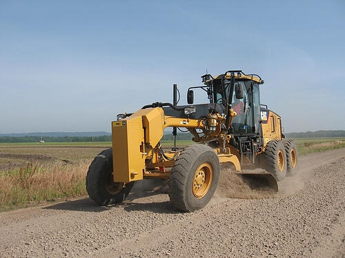 Pope County Road Department Road Grader grading road