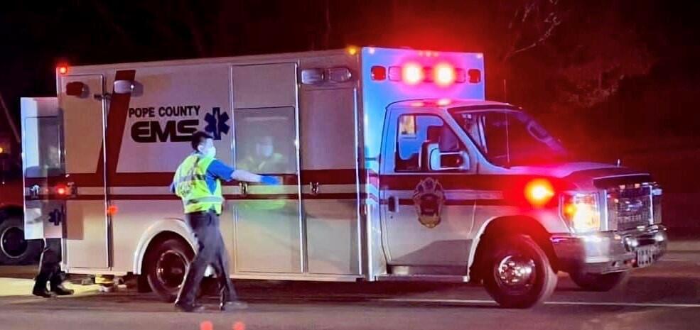 Pope County EMS Ambulance at night with light